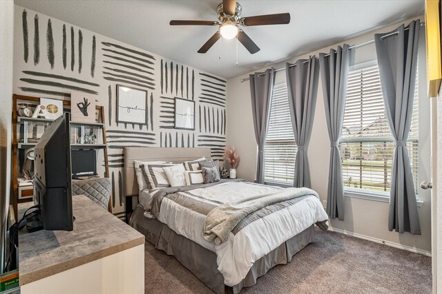 carpeted bedroom featuring ceiling fan and multiple windows