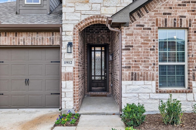 view of exterior entry featuring a garage