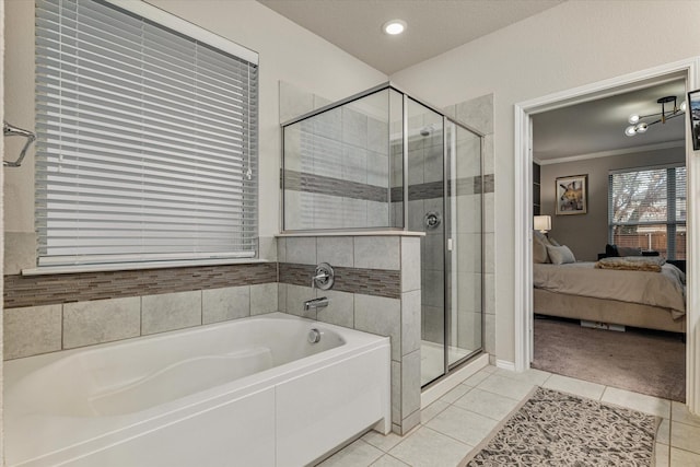 bathroom featuring tile patterned flooring, plus walk in shower, and crown molding