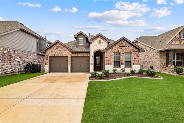 view of front facade featuring a front lawn, central AC unit, and a garage