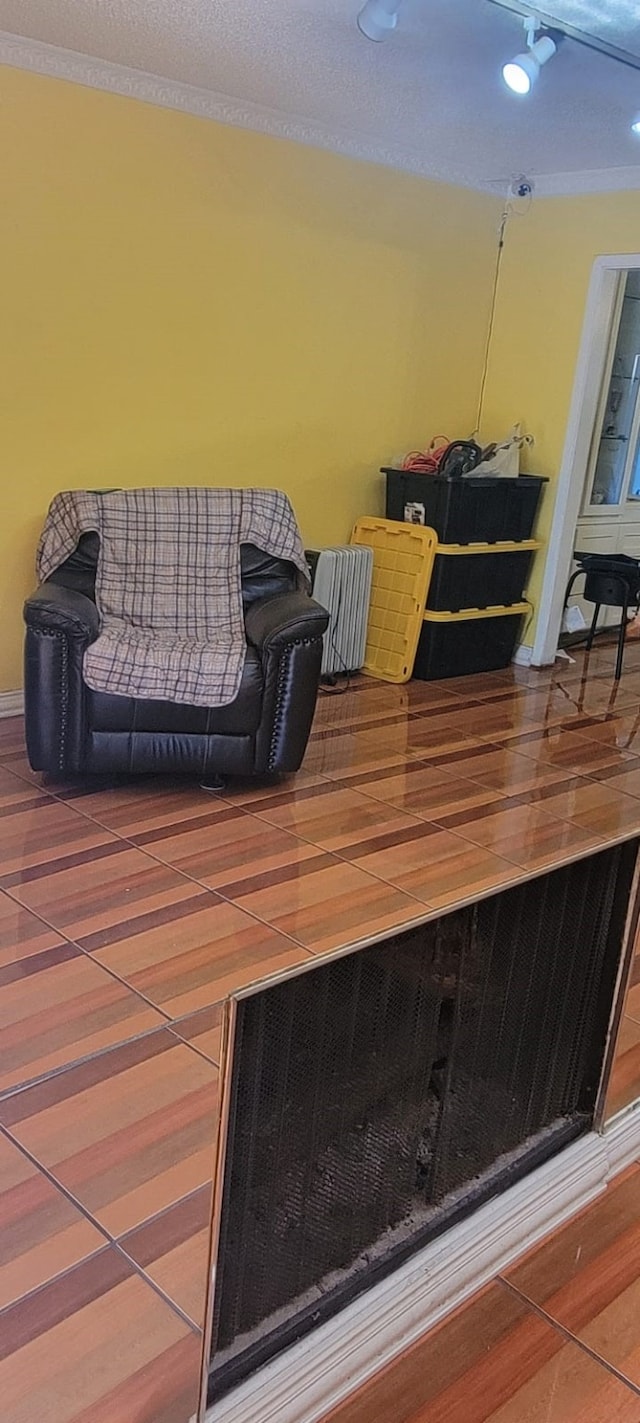 interior space featuring crown molding and hardwood / wood-style floors