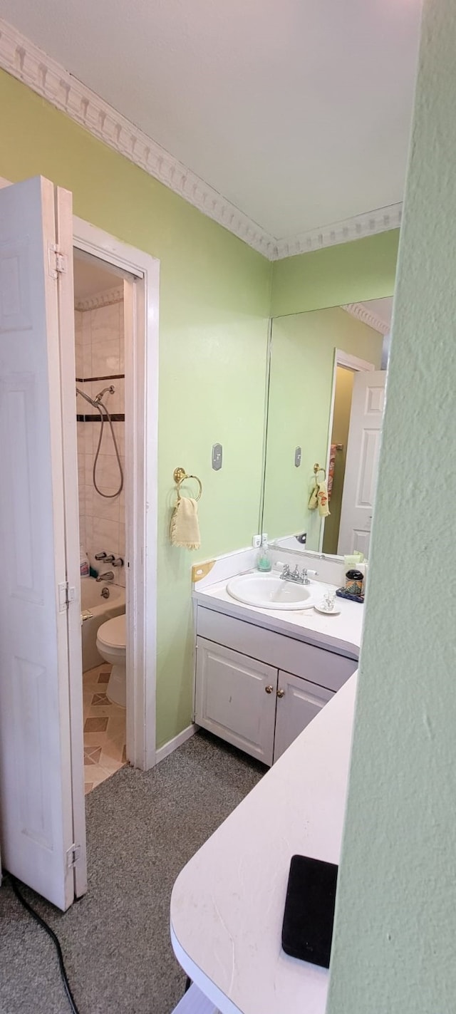 full bathroom with vanity, toilet, and tiled shower / bath combo