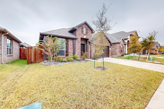 view of front of property with a garage and a front lawn