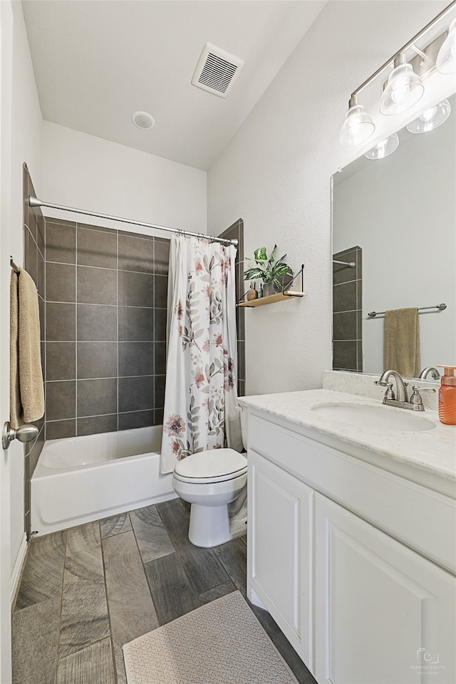 full bathroom featuring toilet, vanity, wood-type flooring, and shower / bathtub combination with curtain