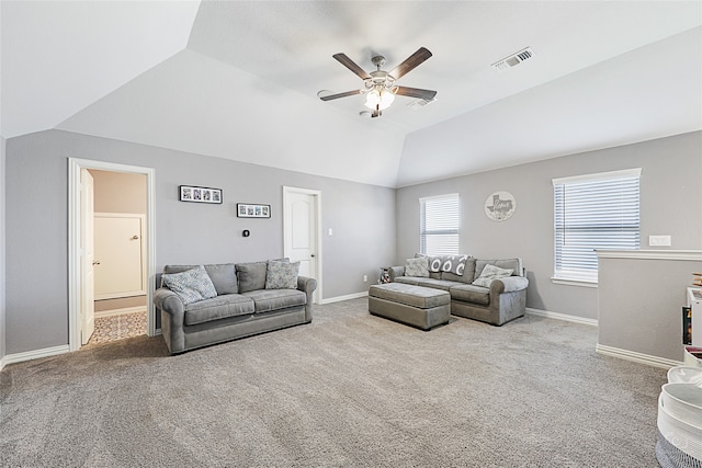 living room with light carpet and vaulted ceiling