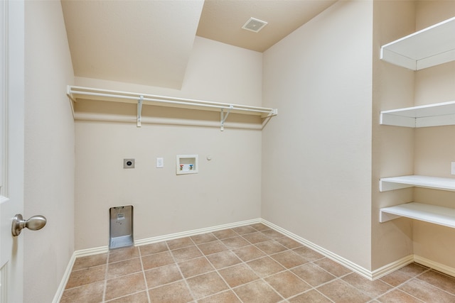 laundry area with electric dryer hookup, gas dryer hookup, tile patterned floors, and washer hookup