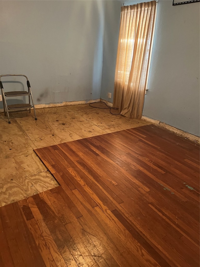 empty room featuring hardwood / wood-style floors