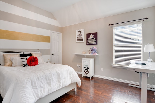 bedroom with lofted ceiling and dark wood-type flooring