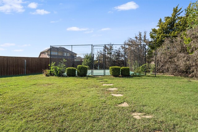 view of yard with tennis court