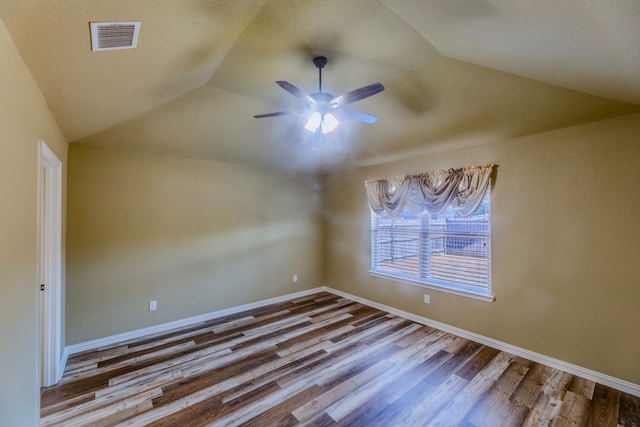 unfurnished room with wood-type flooring, ceiling fan, and vaulted ceiling