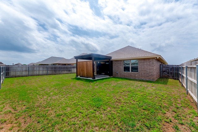 rear view of property with a lawn