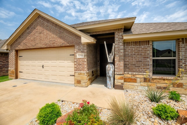 ranch-style home featuring a garage