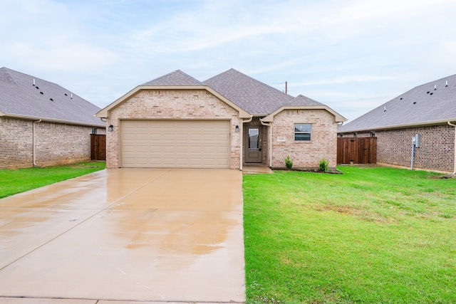 view of front facade with a garage and a front yard