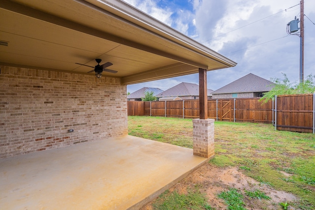 view of yard featuring a patio and ceiling fan