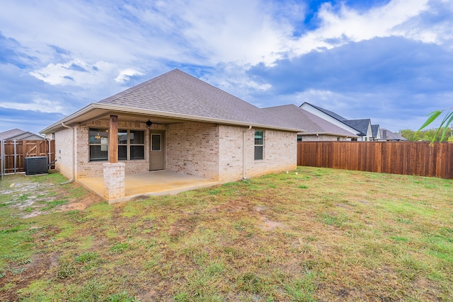 back of house with a patio, a yard, central air condition unit, and ceiling fan