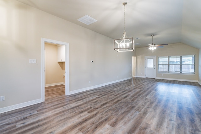 interior space with ceiling fan with notable chandelier, wood-type flooring, and lofted ceiling