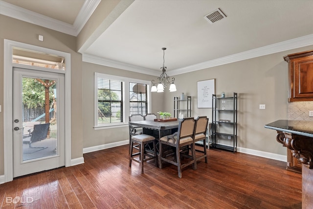 dining area with a healthy amount of sunlight, dark hardwood / wood-style flooring, and crown molding