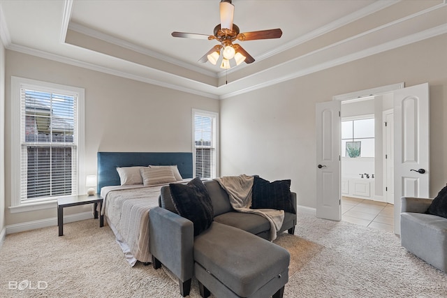 carpeted bedroom with ceiling fan, multiple windows, a raised ceiling, and ornamental molding