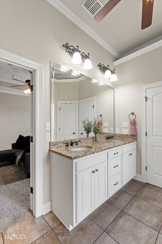 bathroom with ceiling fan, tile patterned flooring, vanity, and ornamental molding