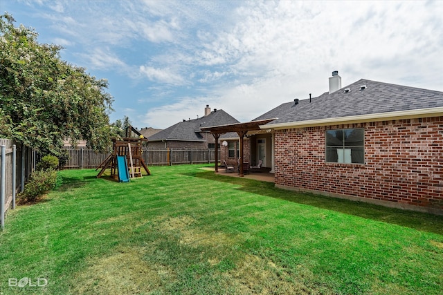 view of yard featuring a patio and a playground