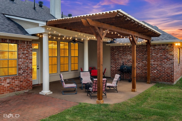 patio terrace at dusk featuring a pergola and a grill