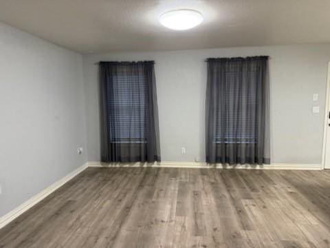 empty room featuring hardwood / wood-style floors