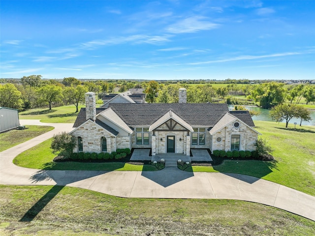 view of front of home featuring a water view and a front yard