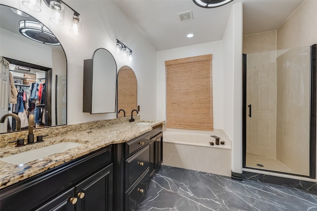 bathroom with plus walk in shower and vanity