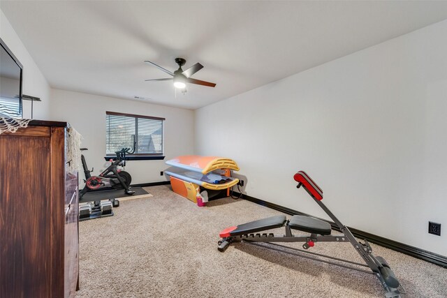 exercise area with carpet floors and ceiling fan