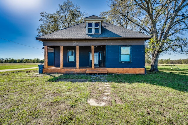 bungalow featuring a front yard and a porch