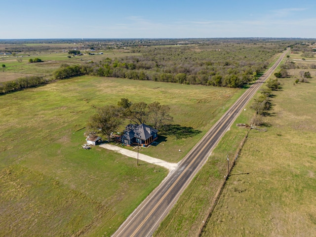 birds eye view of property featuring a rural view