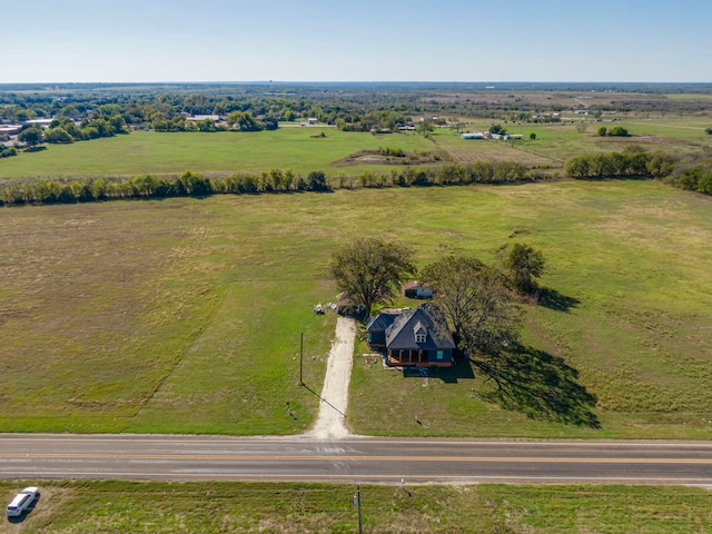 birds eye view of property with a rural view