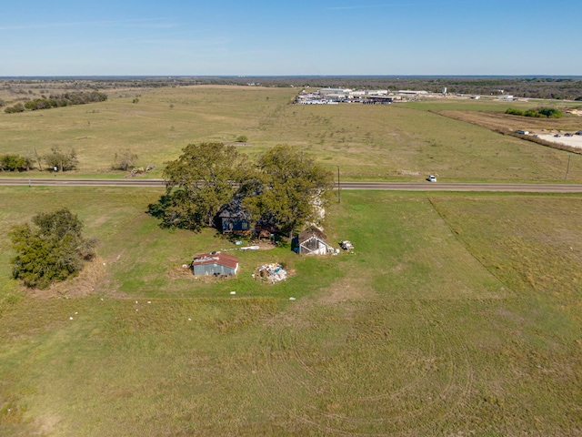 birds eye view of property featuring a rural view