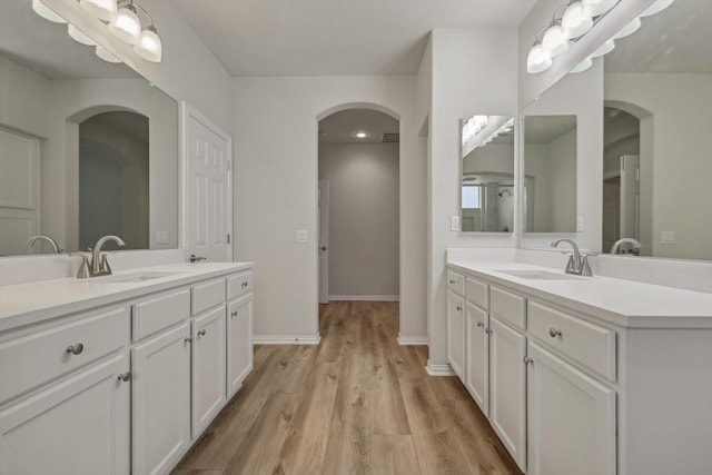 bathroom with vanity and wood-type flooring