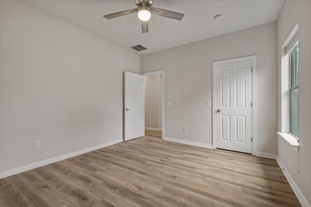 unfurnished bedroom featuring light hardwood / wood-style floors and ceiling fan