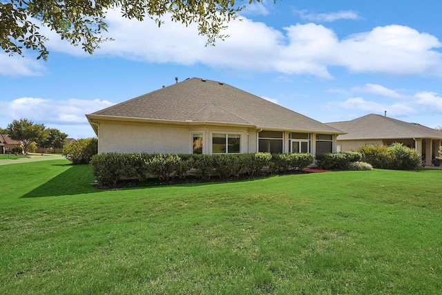 back of house featuring a yard