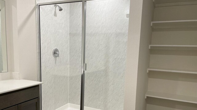 bathroom with vanity and an enclosed shower