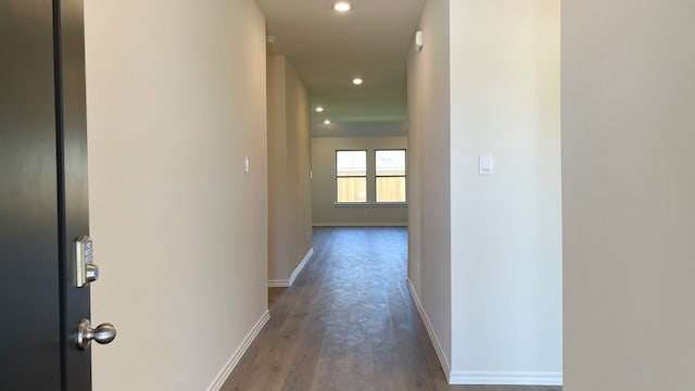 hall with dark wood-type flooring