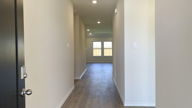 hallway with dark hardwood / wood-style floors