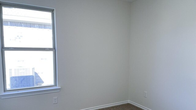 view of carpeted spare room