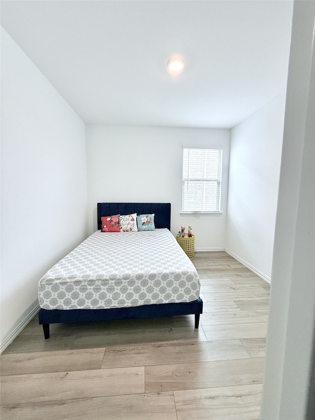 bedroom featuring light wood-type flooring