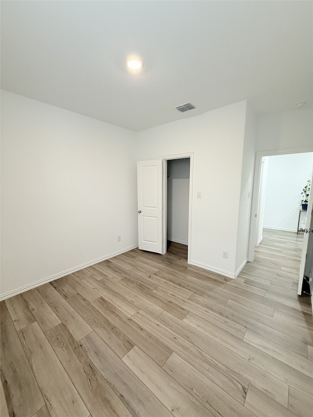 unfurnished bedroom with light hardwood / wood-style floors