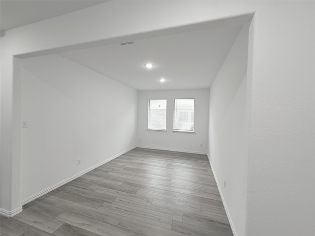 empty room with light hardwood / wood-style floors