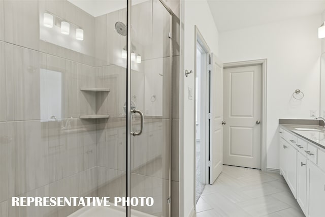 bathroom with vanity and walk in shower