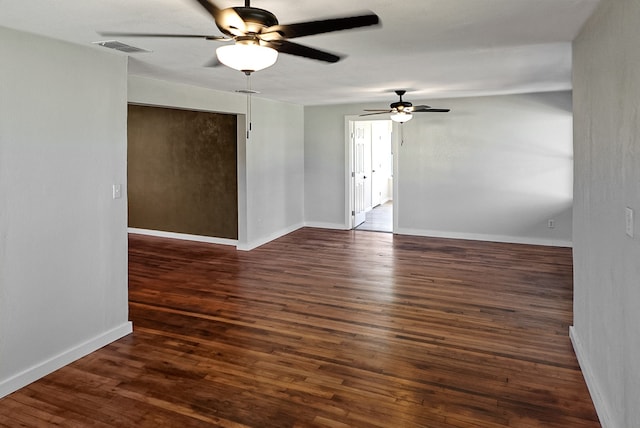 unfurnished room featuring dark hardwood / wood-style floors and ceiling fan