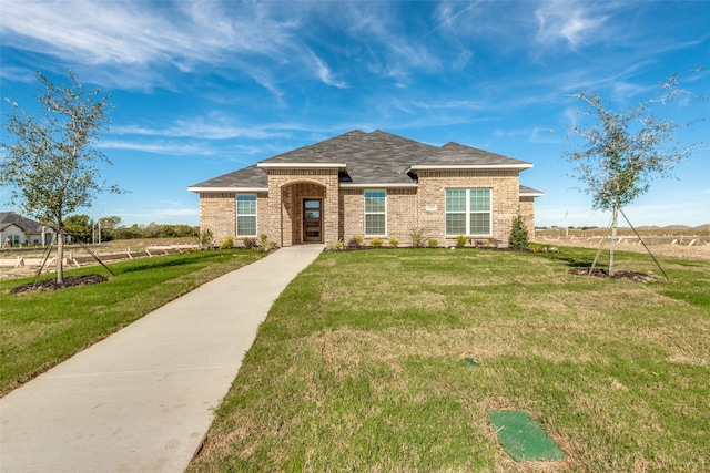 ranch-style house with a front yard