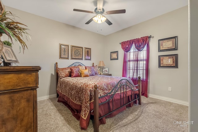 bedroom with ceiling fan and light colored carpet