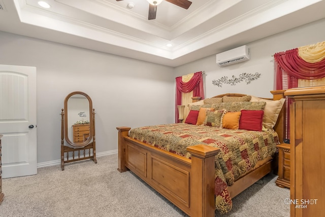 carpeted bedroom featuring a raised ceiling, ceiling fan, crown molding, and a wall mounted air conditioner