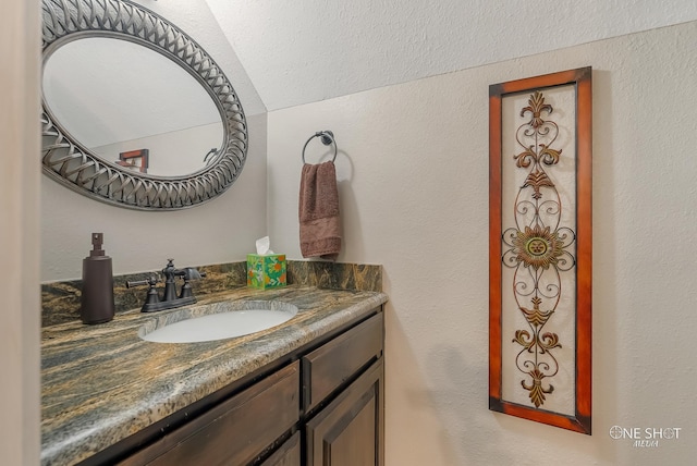 bathroom with vanity and a textured ceiling