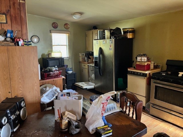 kitchen with light wood-type flooring and appliances with stainless steel finishes